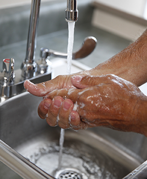 Handwashing with soap and running water.