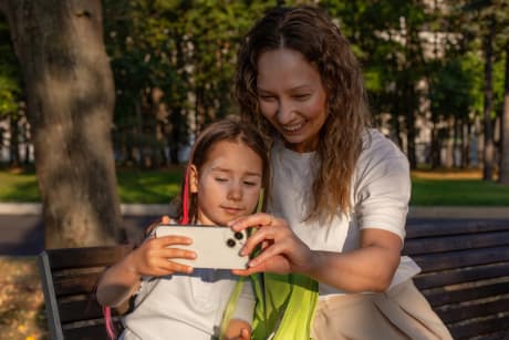 Parent spending time with a child at the park.