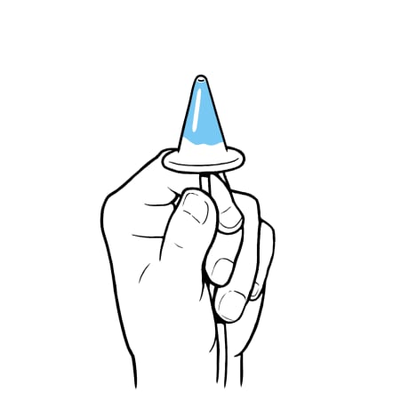 Hand holding end of tubing with cone upright.