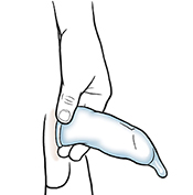 Condom being held at base of penis.