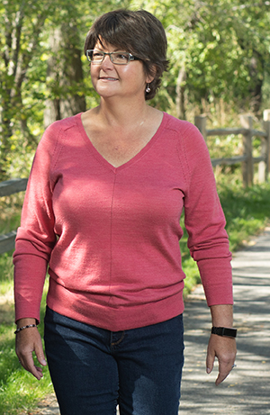 Woman walking outdoors.