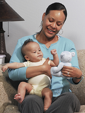 Woman holding baby.