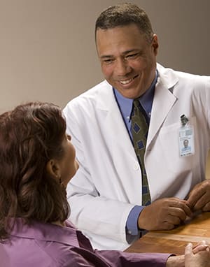 Doctor talking to woman.
