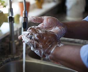 Closeup of handwashing in sink.